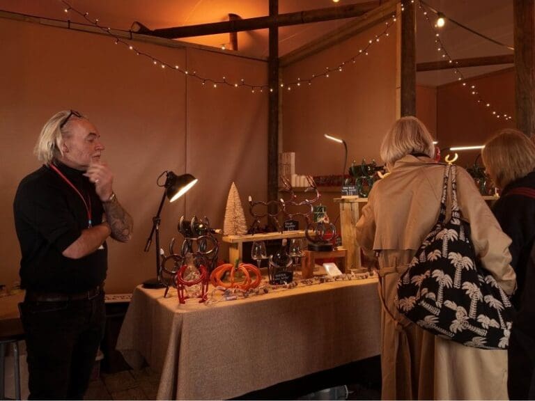 Winchester Christmas Market, next to Winchester Cathedral, part of Anderson Tours Christmas Tour from London.