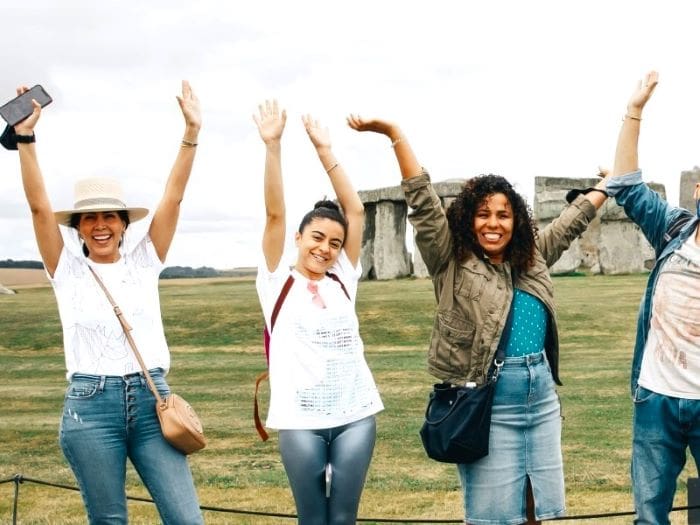 Tours of the unit Kingdom with passengers in Stonehenge enjoying their tour.