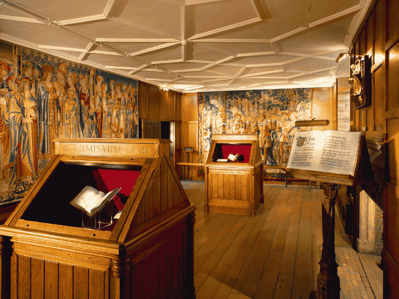 The Book of Hours Room at Hever Castle displaying Anne Boleyn’s prayer books and Tudor manuscripts — included on the Anderson Tours Leeds and Hever Castle Day Tour from